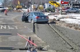 Car drives on wet concrete
